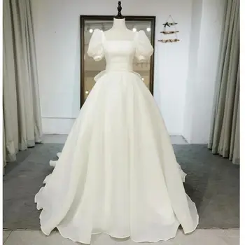 Ezkuntza Vasarinės naujos vestuvinės suknelės Vintažinės trumpos pūstos rankovės Suvarstomos nuotakos suknelės Bow Pincess Ball Gown Plus Size Made Custom